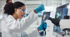 glass vial, pipette and woman scientist in laboratory for medical study, research or experiment test tube, dropper and professional female person with chemical liquid for pharmaceutical innovation 