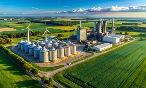 midwest ethanol plant & grain elevators: aerial view with wind turbines